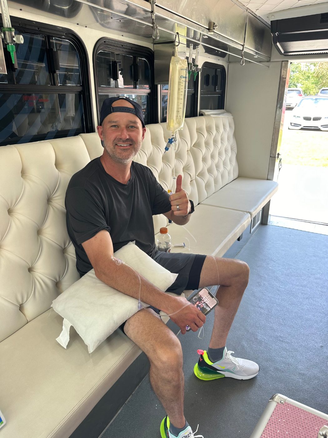 A happy client relaxing during a mobile IV infusion