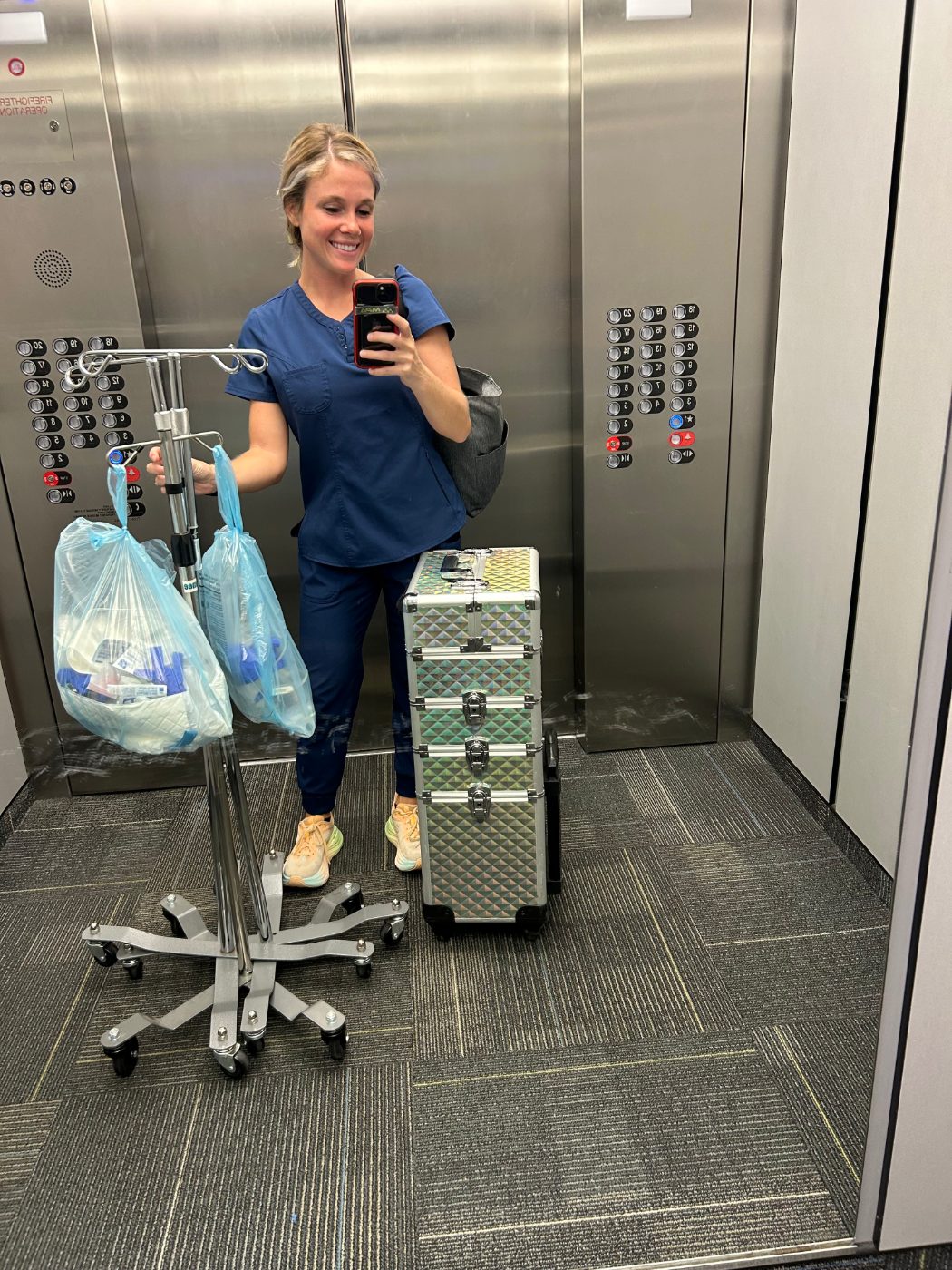 Tiffany bringing her mobile IV kit up to a client
